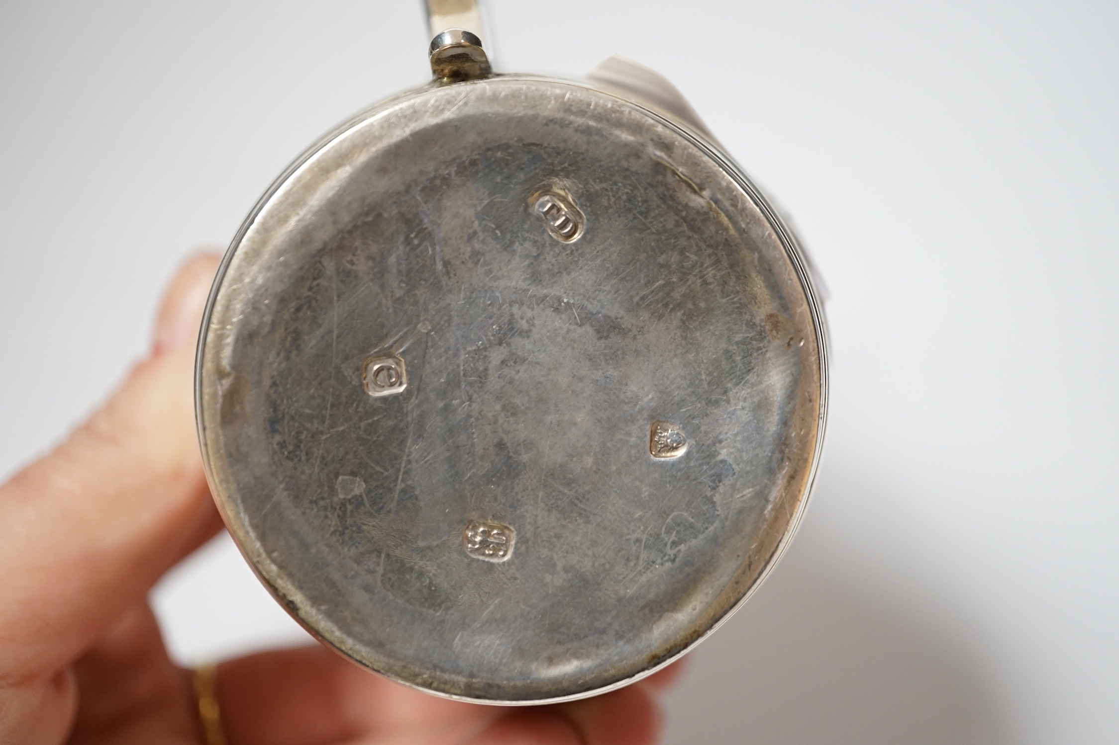 A George III silver barrel shaped mustard pot, Thomas Daniell, London, 1780, 8cm, with later blue glass liner.